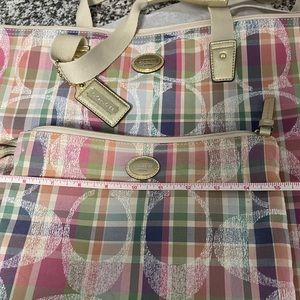 Authentic Coach multi colored travel bag with pouch